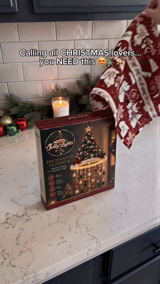 Warm hanging Christmas decoration glowing in a festive home